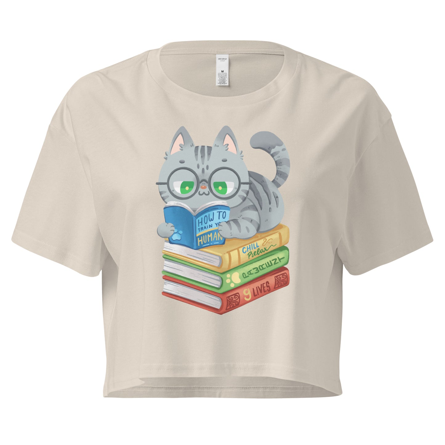 Beige crop top with cat in glasses reading on top of a pile of books design