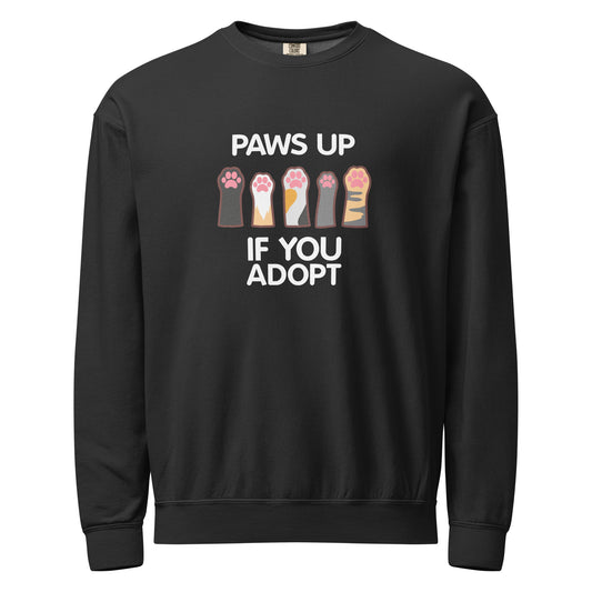 Black crewneck sweatshirt with paw prints design and text 'PAWS UP IF YOU ADOPT'