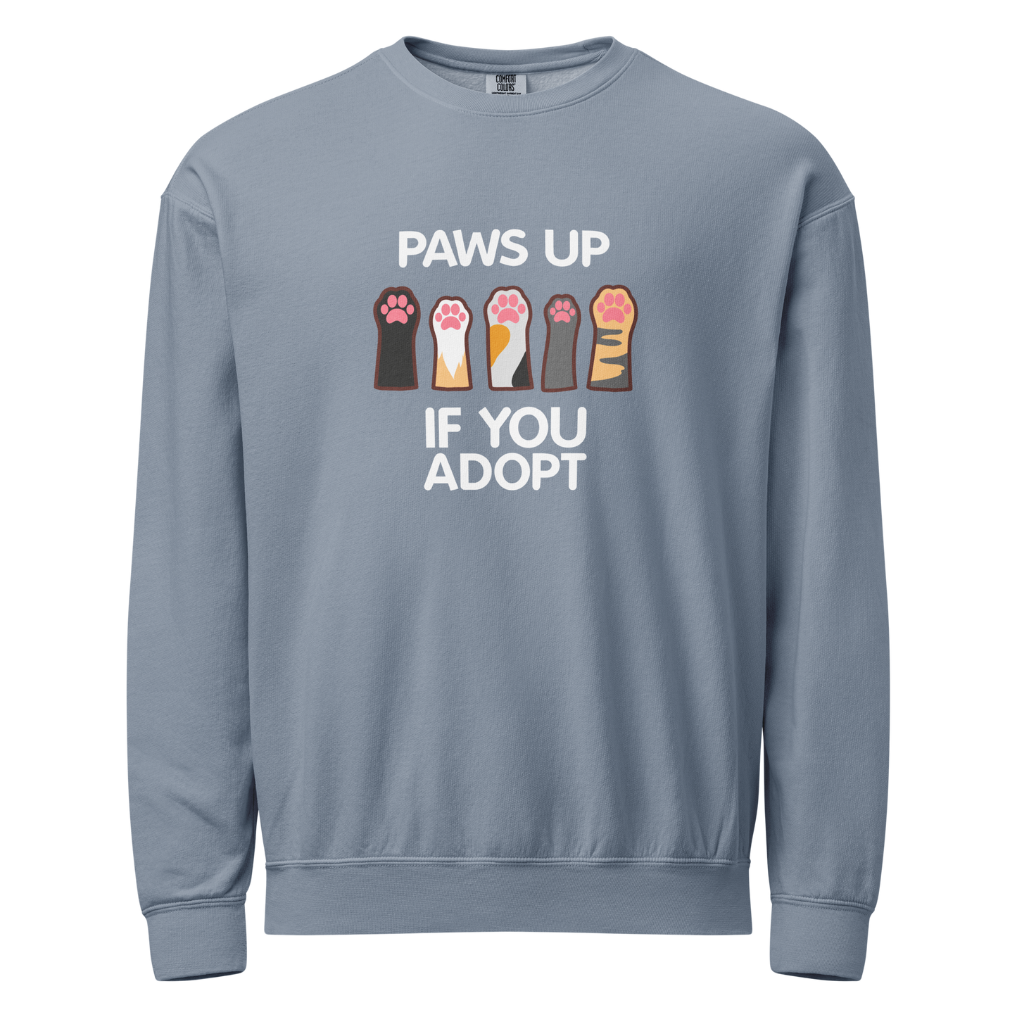 Blue crewneck sweatshirt with paw prints design and text 'PAWS UP IF YOU ADOPT'